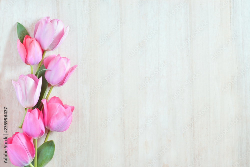 Tulip flowers on a wood background 
