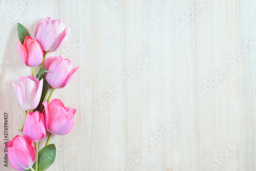 Tulip flowers on a wood background 