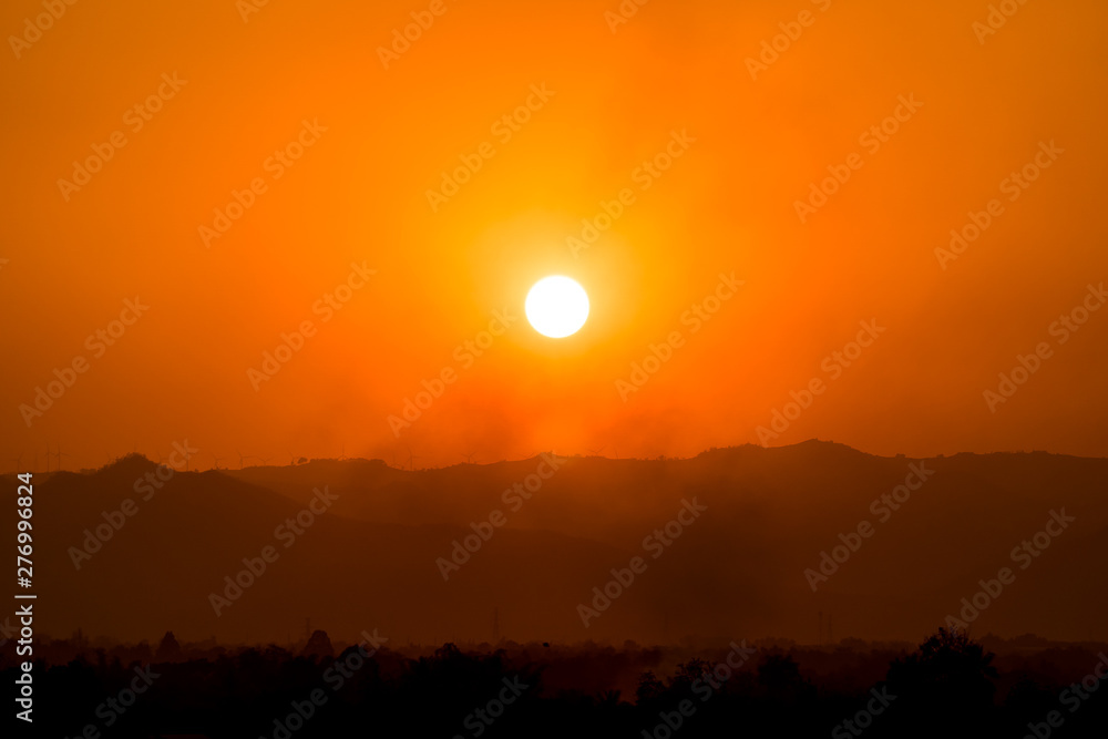 The landscape in hot day background silhouette mountain and jungle in the sunset summer.