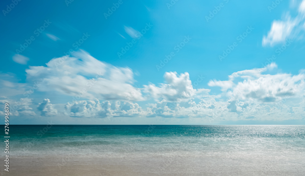 Background of Andaman sea, sand, beach with blue sky, white cloud and copy space in summer at  Phuket Thailand