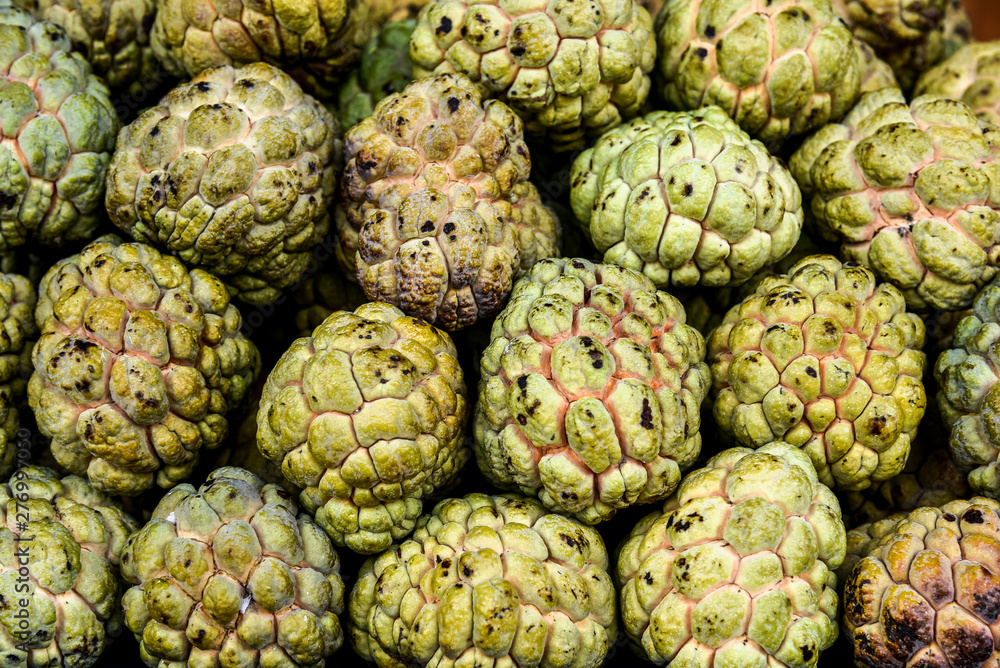 Fototapeta premium Close up Background and texture fresh custard apple fruit in the market.