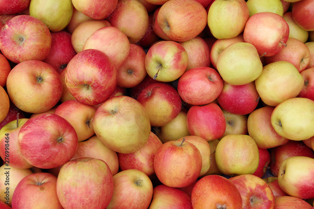 Close up full frame view of fuji apples displayed for sale at a market stand