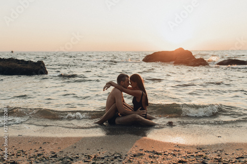 lovely couple kissing in the sea