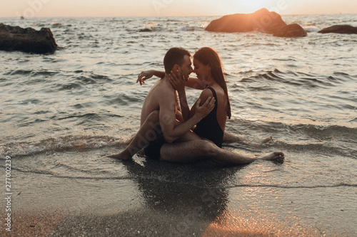 lovely couple kissing in the sea