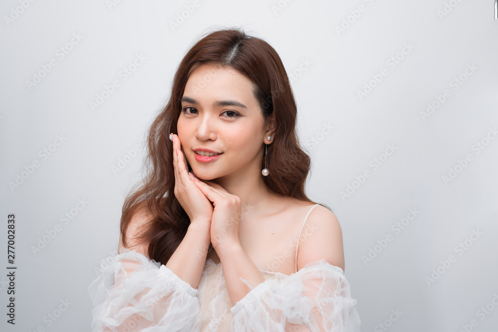 Closeup beautiful young asian woman face isolated on white Closeup beautiful young asian woman face isolated on white
