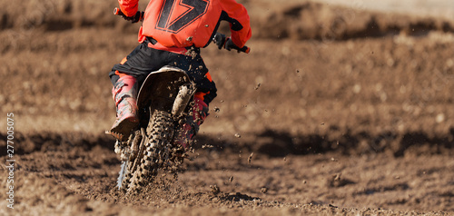 Fotografía Racer child on motorcycle participates in motocross race, active extreme sport