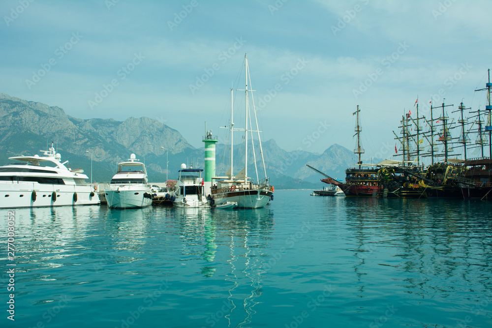 Yachts and ships in the port of Kemer, Sunny day,beautiful sea, Antalya, Turkey.