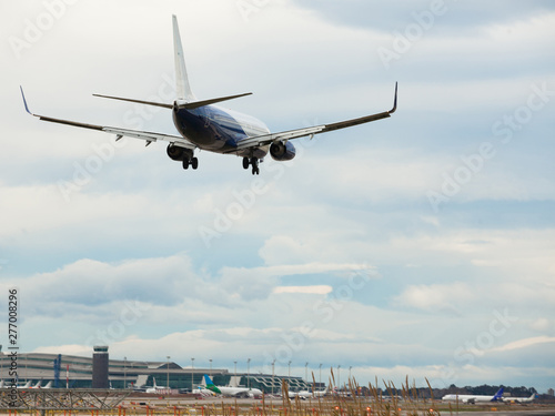 modern passenger plane lands at airport