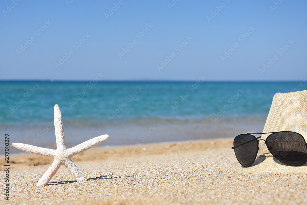 Summer vacation accessories on the beach. Summer holidays background, concept of vacations Summer vacation accessories on the beach. Summer holidays background, concept of vacations