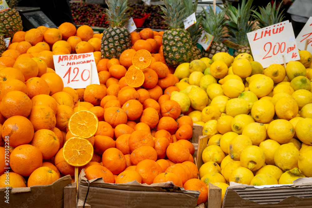 Orange and lemon on a market stall