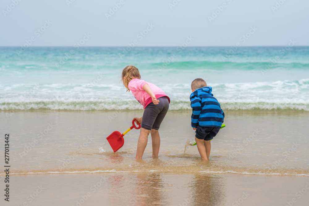 Kids playing on the sea shore Kids playing on the sea shore