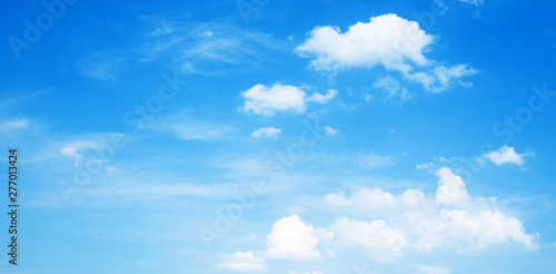 Fototapeta Naklejka Na Ścianę i Meble -  Sunny background, blue sky with white clouds 