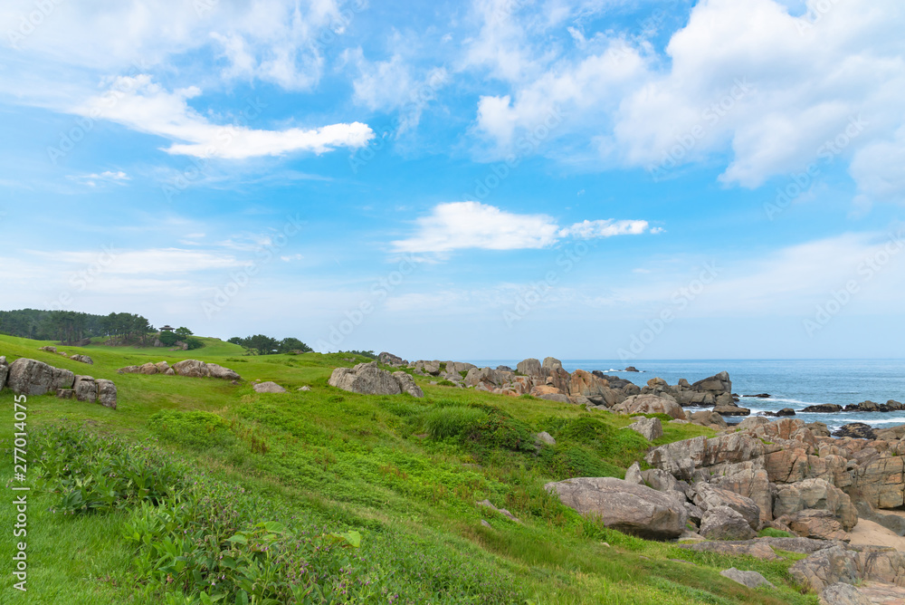 Beautiful Tanesashi kaigan Coast. The coastline includes both sandy and rocky beaches, and grassy meadows scenic views