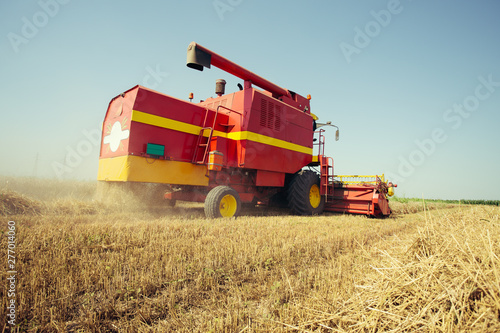 Combine harvester working on a wheat field