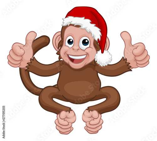 A Christmas monkey animal cartoon character in a Santa hat giving two thumbs up