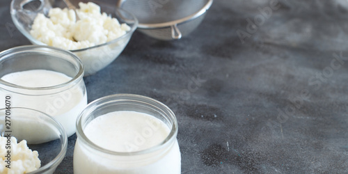 Fermented drink kefir in small bottles and kefir grains