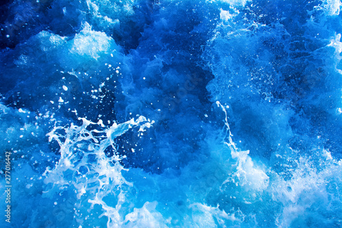 turbulent and splashing sea water, blue color