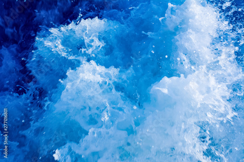 turbulent and splashing sea water, blue color