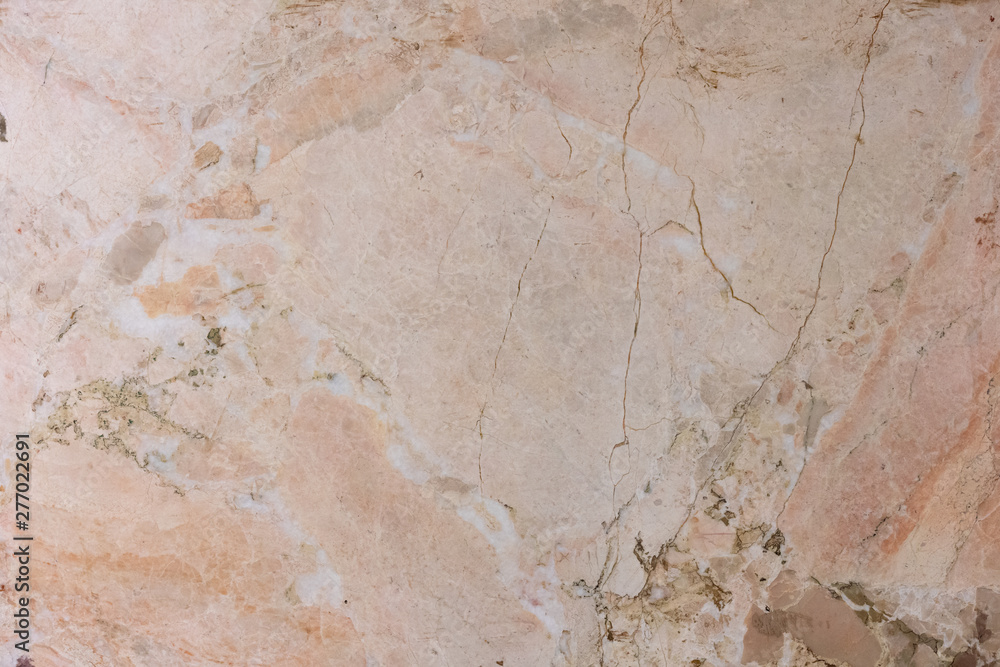 marble tiles with stains of different colors and sizes with cracks from old age