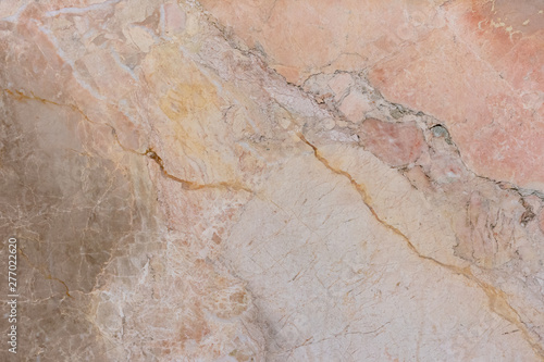 marble texture affected by long use. The wall of the underground storage of red color.