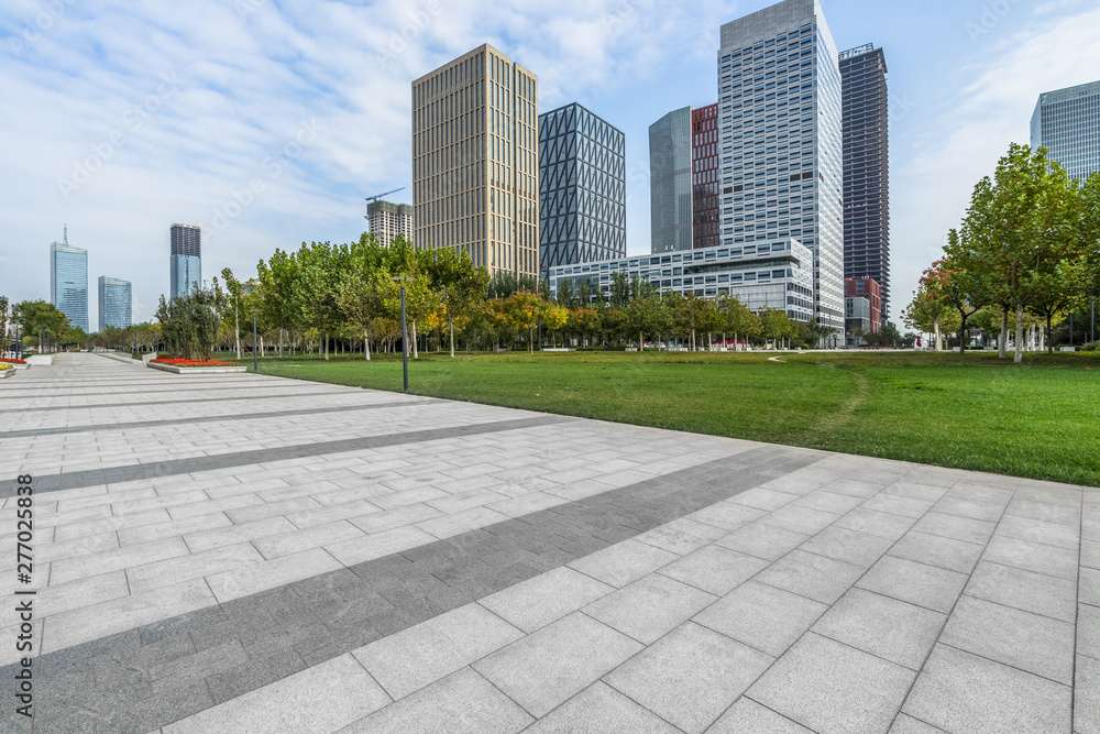 Panoramic skyline and buildings with empty square floor.