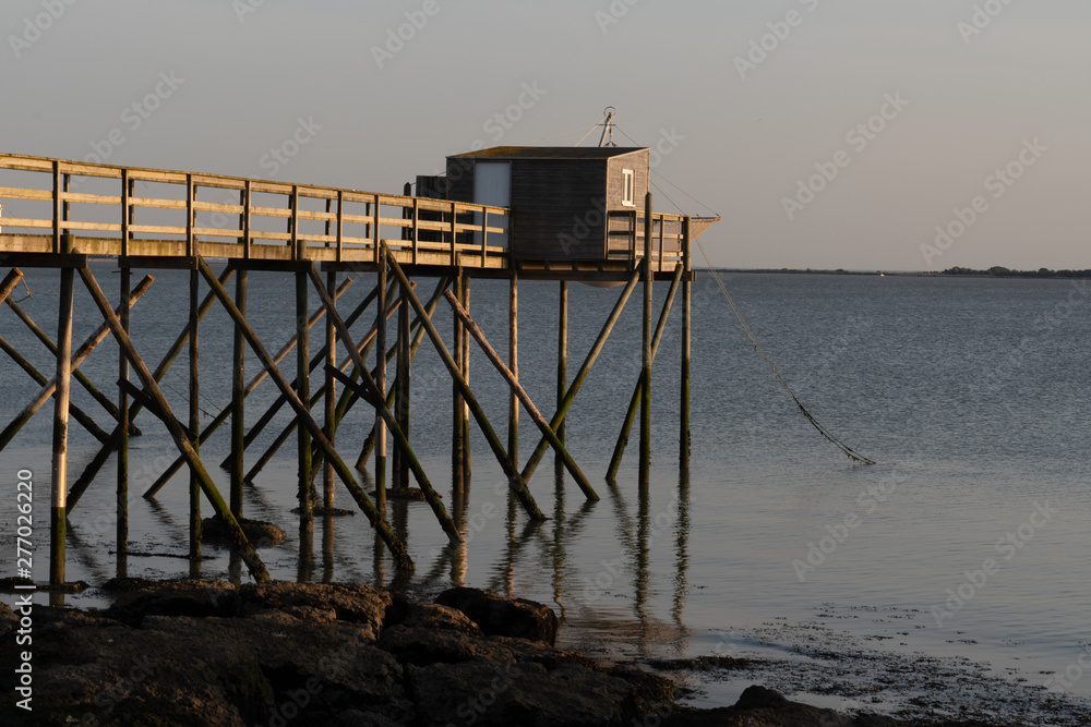 fishing huts on stilts at Fouras Aquitaine France at dusk fishing huts on stilts at Fouras Aquitaine France at dusk