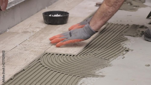 Laying tiles in bathroom