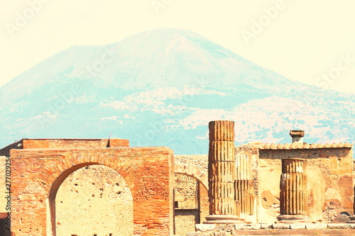 Ancient ruins in Pompeii against backdrop of great volcano Vesuvius, Naples, Italy.