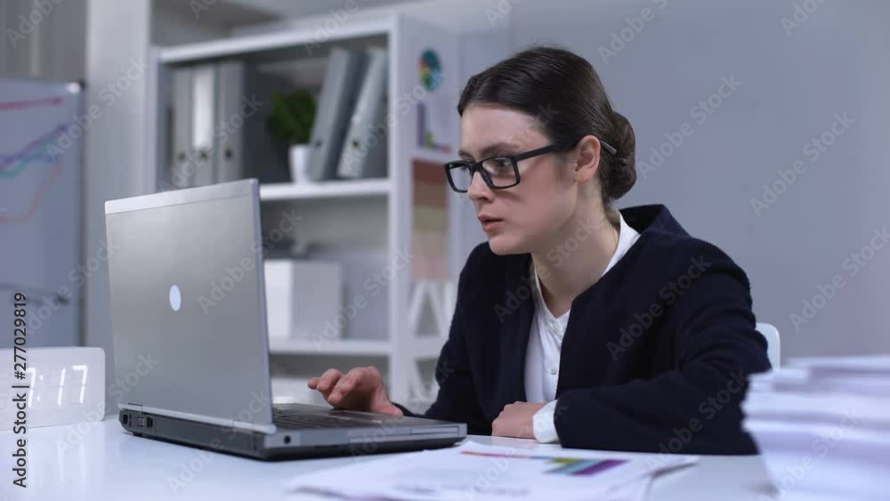 Happy female stock exchange trader making yes gesture, satisfied with income Happy female stock exchange trader making yes gesture, satisfied with income