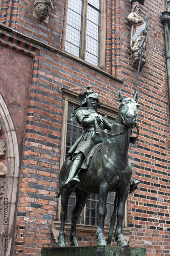 Bremen, Germany - 06/15/2019: bronze statue of medieval knights near Bremen town hall. Cultural heritage of Germany. Ancient sculptures in center of Bremen. Medieval art and architecture.