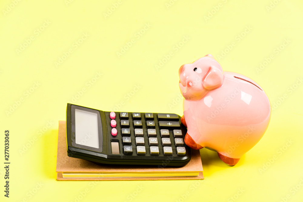 Payoff. money saving. Accounting and payroll. moneybox with calculator. Piggy bank. bookkeeping. financial report. capital management. planning counting budget. Commerece business Payoff. money saving. Accounting and payroll. moneybox with calculator. Piggy bank. bookkeeping. financial report. capital management. planning counting budget. Commerece business