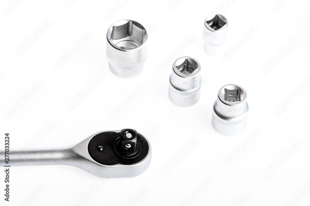 Top notch service. socket wrench isolated on white background. various wrench heads and tips. Socket wrench toolbox. Toolbox, tools kit detail close up. Top notch service. socket wrench isolated on white background. various wrench heads and tips. Socket wrench toolbox. Toolbox, tools kit detail close up.