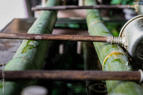It is a place to cleanse hands at a Japanese shrine.
