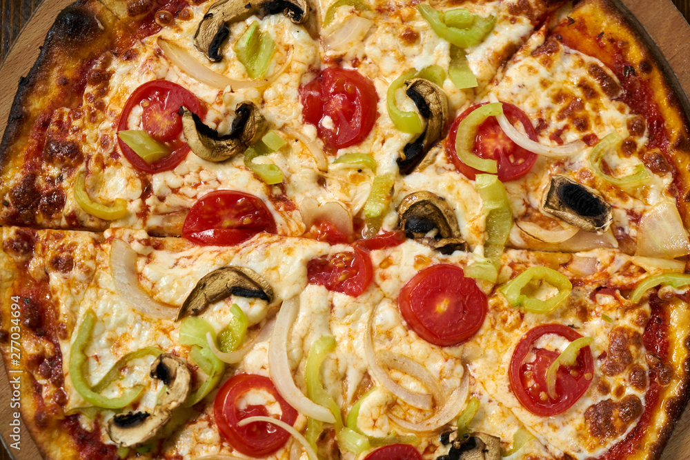 Delicious pizza with vegetables on the table Delicious pizza with vegetables on the table