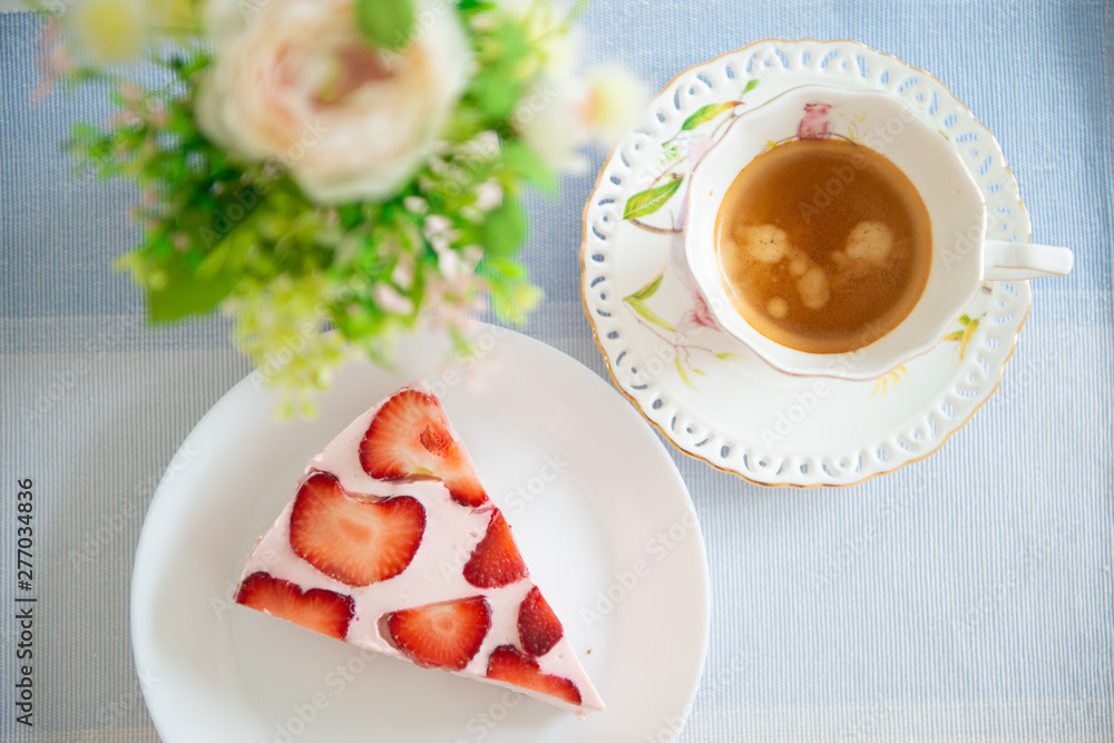 Fresh cheesecake with strawberries on a table Fresh cheesecake with strawberries on a table