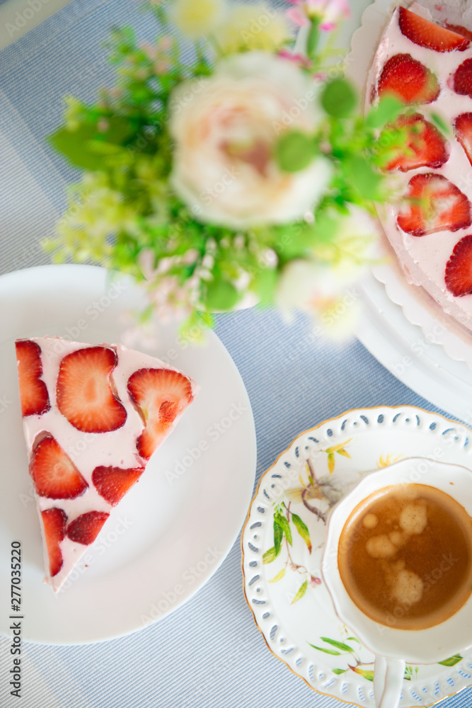 Fresh cheesecake with strawberries on a table Fresh cheesecake with strawberries on a table
