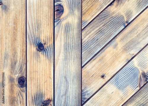Texture of the boards of an old wooden table in antique colors. Vintage rustic wooden background.
