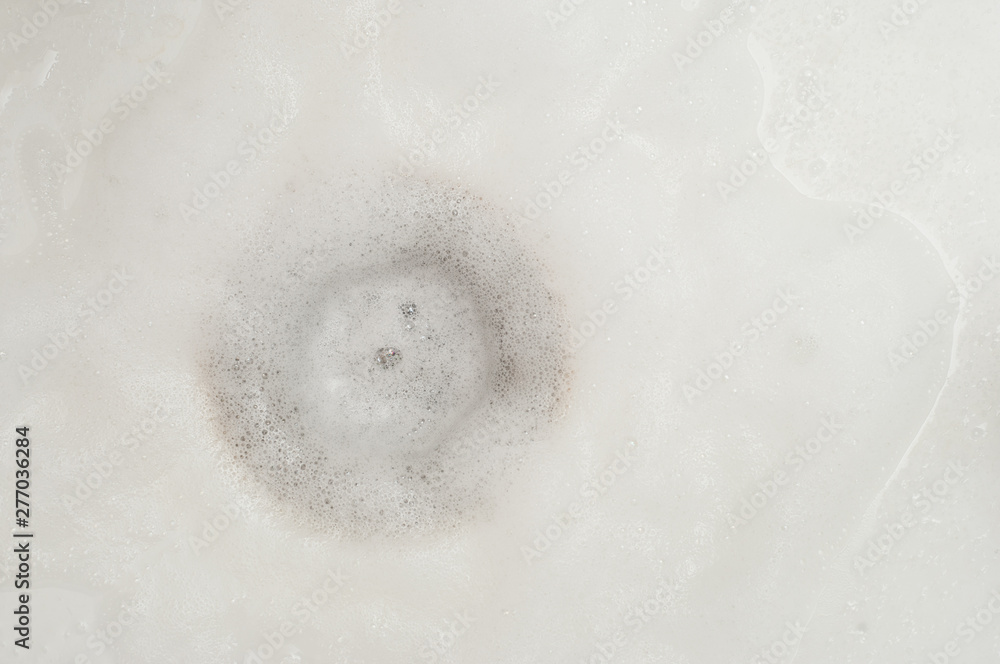 Foam from washing in a white car wash Foam from washing in a white car wash