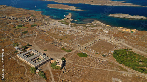 Aerial drone panoramic distant view of famous archaeological site a whole ancient citadel in island of Delos, Cyclades, Greece photo