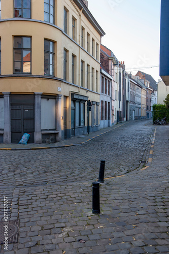 Gent. Belgium. Empty extinct street with coblestones. Eveninglight. photo