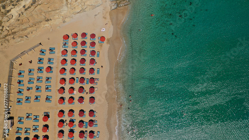 Aerial drone photo of famous organised with sun beds and umbrellas beach of Lia with emerald clear sandy sea shore, Mykonos island, Cyclades, Greece   photo