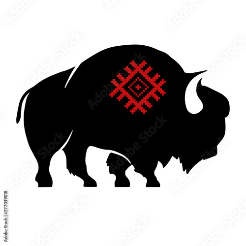Abstract silhouette of bison with slavic red national ornament