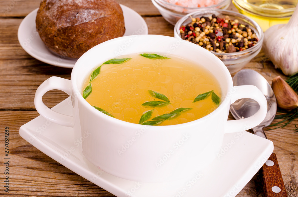 Chicken broth soup in white plate. Photo Chicken broth soup in white plate. Photo