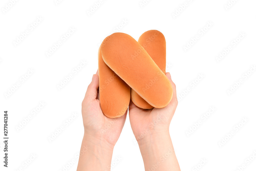 Hot dog bread in woman hand isolated on white background.