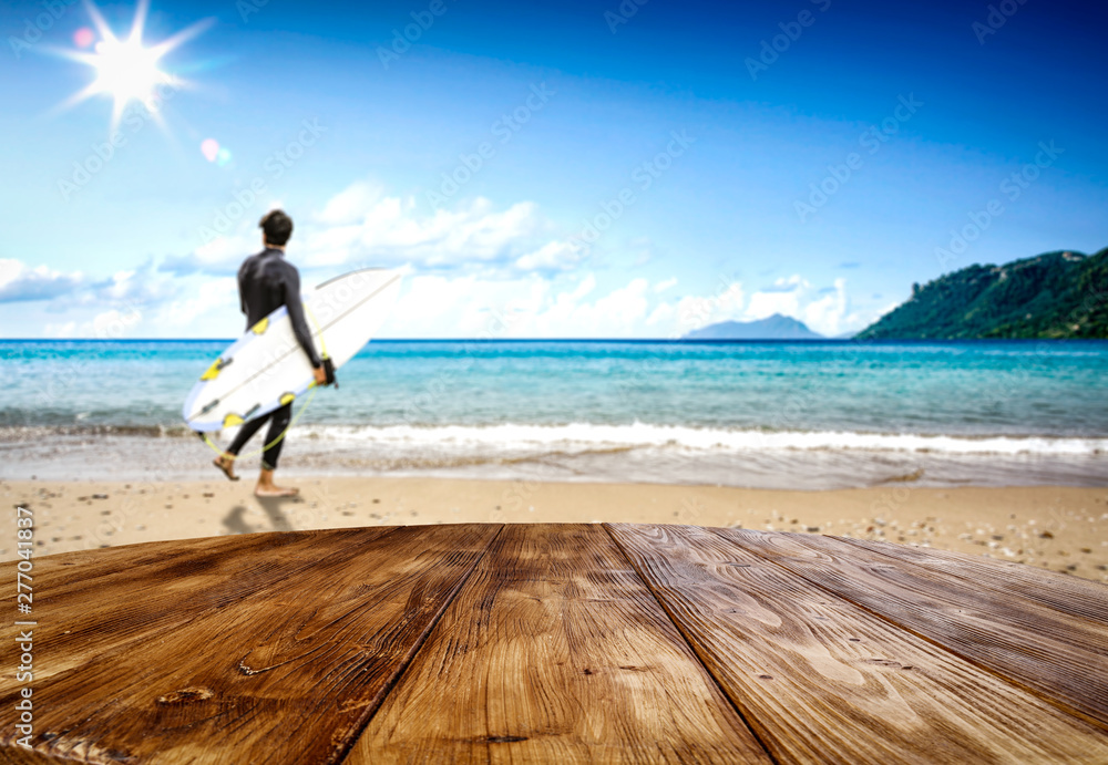 Desk of free space and summer beach background 