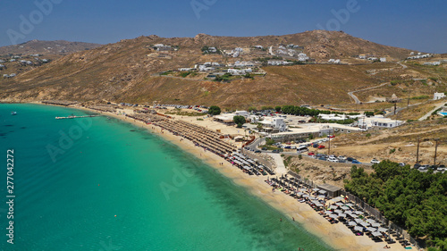 Aerial drone photo of famous organised beach of Elia with emerald clear sandy sea shore, Mykonos island, Cyclades, Greece 
