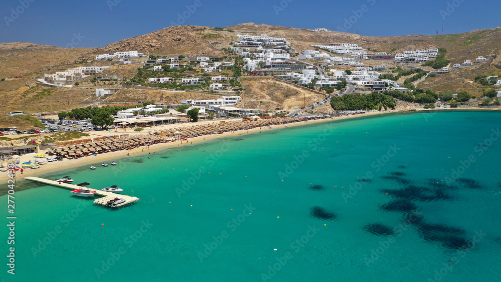 Aerial drone photo of famous organised beach of Elia with emerald clear sandy sea shore, Mykonos island, Cyclades, Greece  