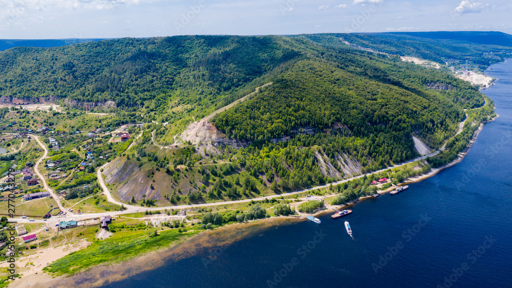  Aerial view from the drone of the village on the background of the hills and the Volga river.