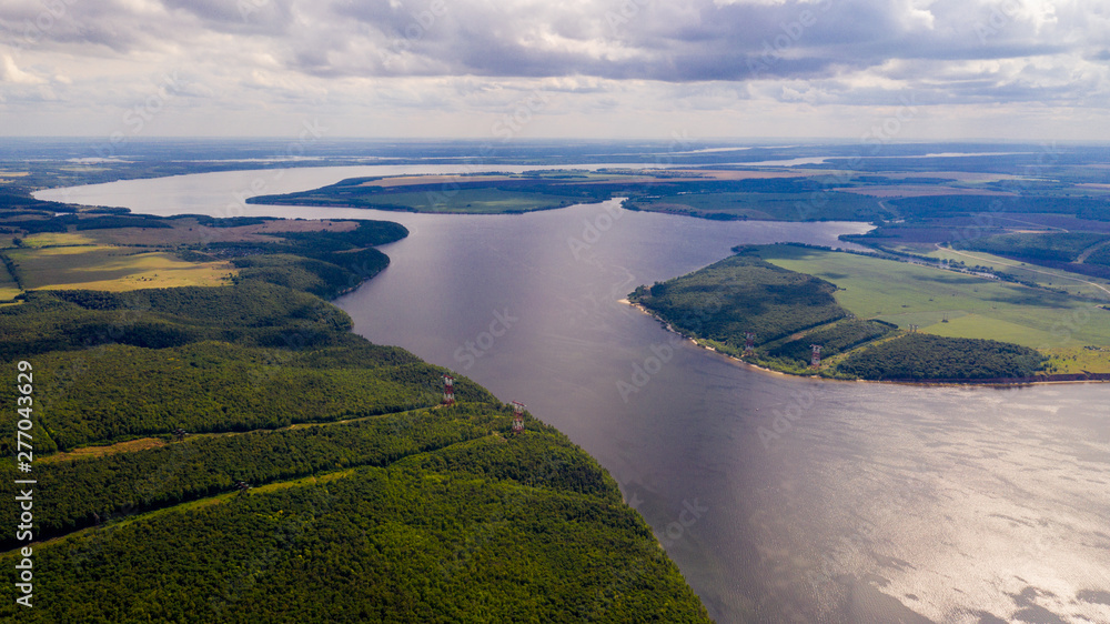 Aerial view from the drone of landscape Volga river flows among the hills and fields. The middle band of Russia. Aerial view from the drone of landscape Volga river flows among the hills and fields. The middle band of Russia.