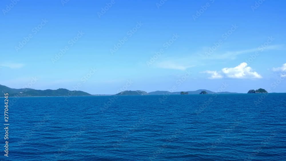 View on sea waves passing by, islands and clear sky View on sea waves passing by, islands and clear sky